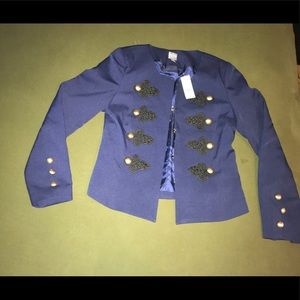 Blue blazer. Black detailing with gold buttons.